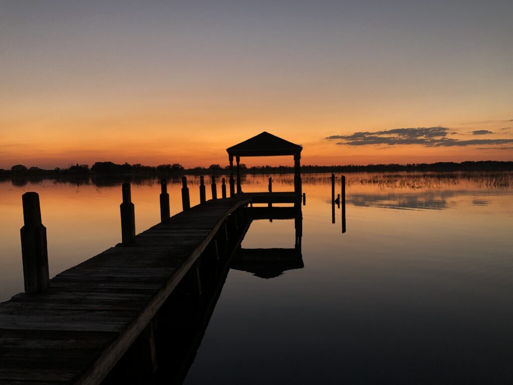 Picture of a dock on late at sunset