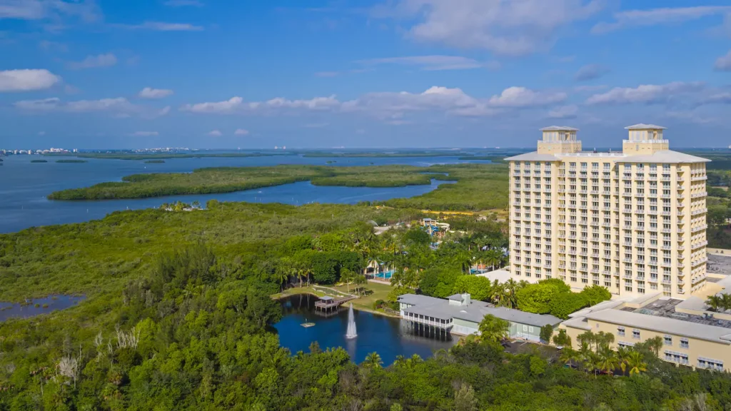 A tall building overlooking an estuary and the Gulf of Mexico